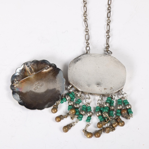 1516 - A Mexican sterling silver amulet pendant necklace, and a Peruvian silver and 18ct gold brooch, 51.1m... 