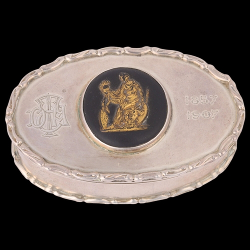 1573 - An Edwardian silver box, Cohen & Charles, Chester 1906, oval form with inset Jasperware plaque and r... 