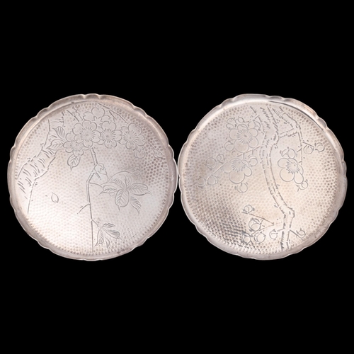 1588 - A pair of Japanese silver drink's coasters, with engraved blossom decoration, 8cm, 2oz total