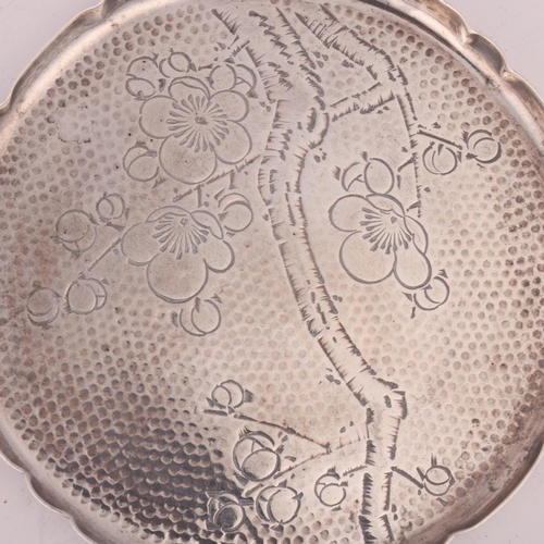 1588 - A pair of Japanese silver drink's coasters, with engraved blossom decoration, 8cm, 2oz total