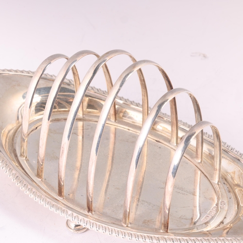 1604 - An Edwardian silver 6-bar toast rack, Atkin Brothers, Sheffield date letter obscured, oval form, on ... 