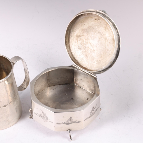 1609 - An Iraqi silver octagonal dressing table box, diameter 8cm, and an Iraqi silver mug, 7cm, 6.8oz tota... 