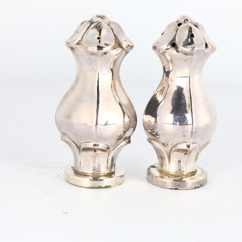 1666 - HUGO GRUN - a pair of Art Nouveau Danish silver pepperettes, 6cm