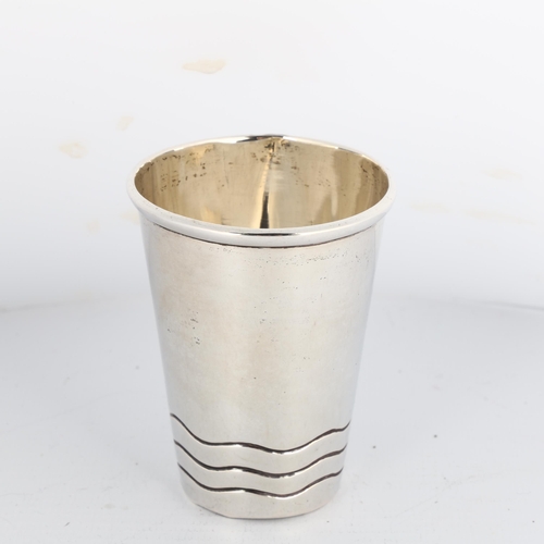 1672 - A Danish silver beaker, circa 1911, tapered cylindrical form, with engraved wave decoration and gilt... 