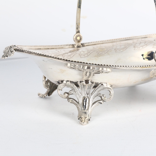 1696 - An Antique German silver swing-handled sweetmeat basket, marked Peter, oval form, with bright-cut an... 