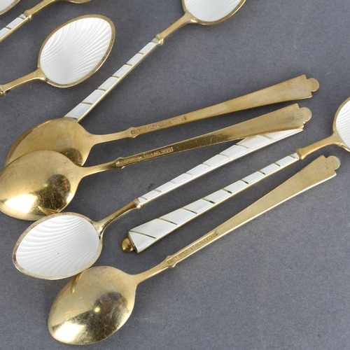 1714 - EGON LAURIDSEN - a set of 9 Danish vermeil sterling silver and white enamel coffee spoons, with enam... 