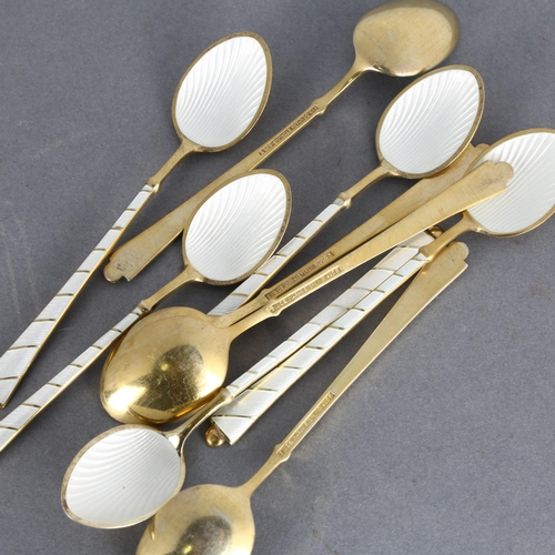 1714 - EGON LAURIDSEN - a set of 9 Danish vermeil sterling silver and white enamel coffee spoons, with enam... 