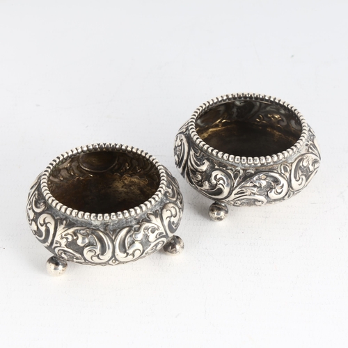 1730 - A pair of late Victorian silver salt cellars, indistinct maker, Birmingham 1899, circular form, with... 