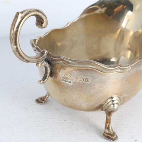 1740 - A George V silver sauce boat, Adie Brothers Ltd, Birmingham 1928, raised scalloped rim with D-shaped... 