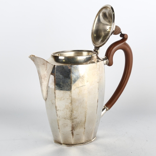 1760 - An Art Deco George V silver teapot, Henry Matthews, Birmingham 1929, oval faceted form, with turned ... 