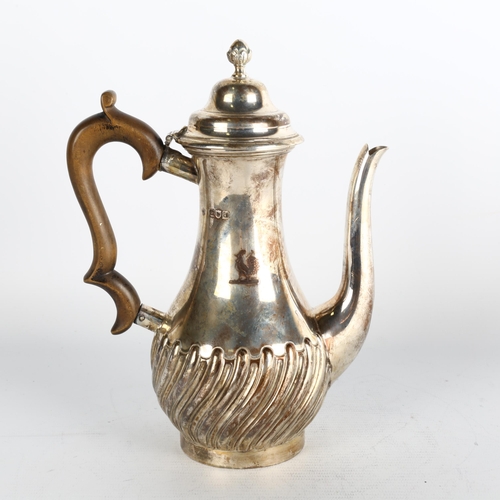 1761 - A late Victorian silver coffee pot, Carrington & Co, London 1899, baluster form, with relief embosse... 