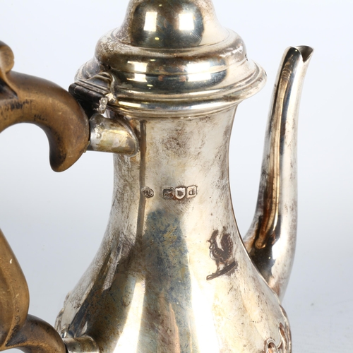 1761 - A late Victorian silver coffee pot, Carrington & Co, London 1899, baluster form, with relief embosse... 