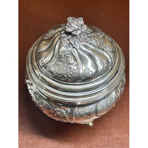 1690 - An Antique Continental silver box and cover, circular form, with allover relief embossed foliate dec... 