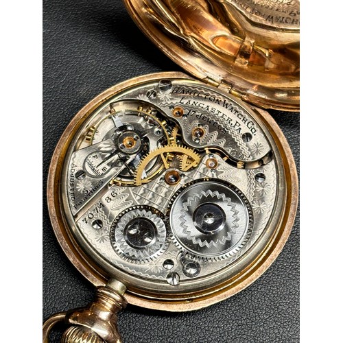 1026 - HAMILTON - a gold plated open-face keyless pocket watch, white enamel dial with Arabic numerals, blu... 