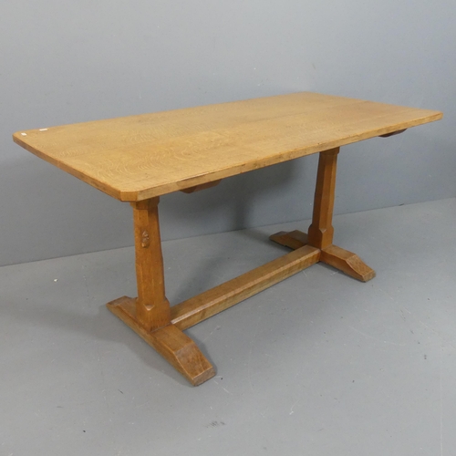 ROBERT MOUSEMAN THOMPSON - An oak refectory style dining table, with 3cm thick plank top, raised on octagonal end column supports with carved mouse and stretcher base. Length 151cm, height 75cm, width 75cm.