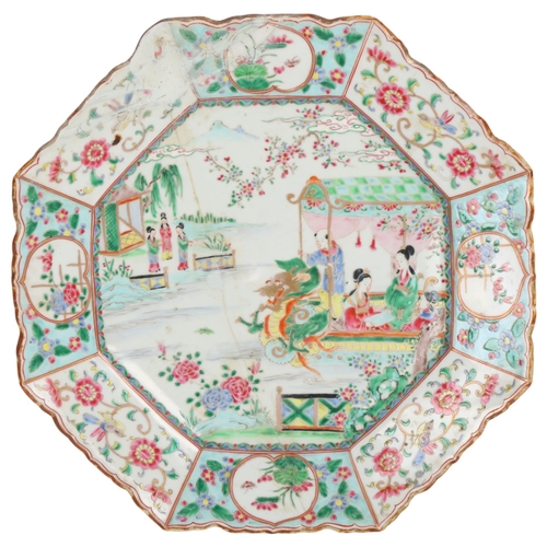 412 - A Chinese octagonal porcelain charger, depicting figures and a water dragon, width 44cm, A/F