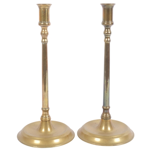 141 - A pair of 19th century brass table candlesticks, 31cm