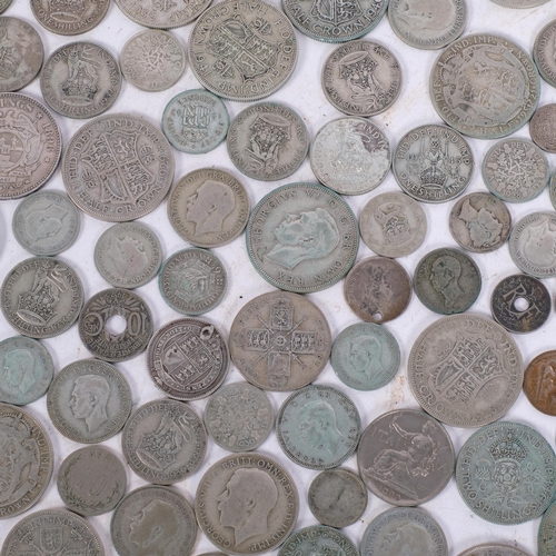 193 - A quantity of pre-1946 mainly English silver coins, and a silver St Christopher