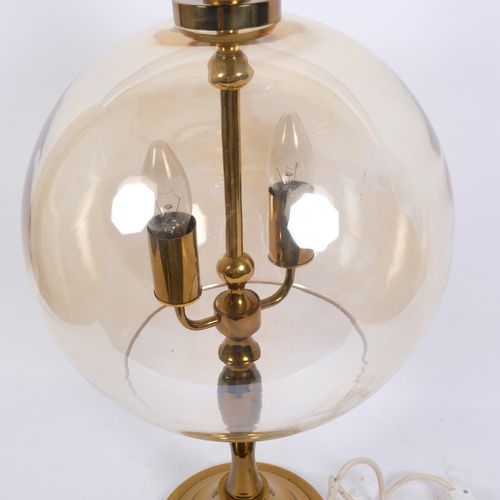 30 - A modern brass amber glass 'Globe' twin light table lamp, H72cm