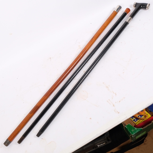 49 - 3 walking canes, including amber-topped ebony example and another with silver collar (3)