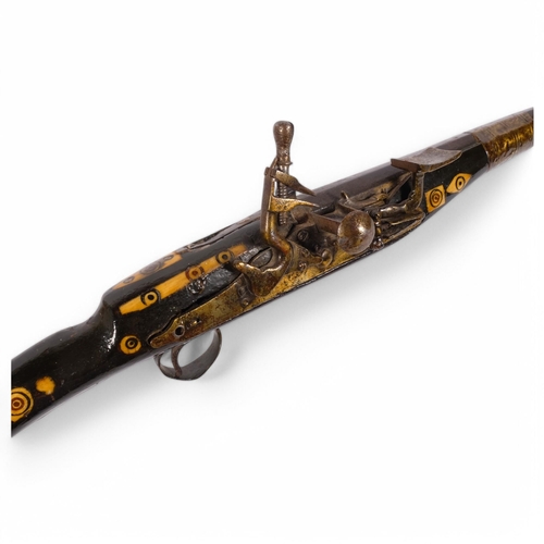 50 - A Moroccan brass and bone inlaid snaphaunce long gun, 150cm