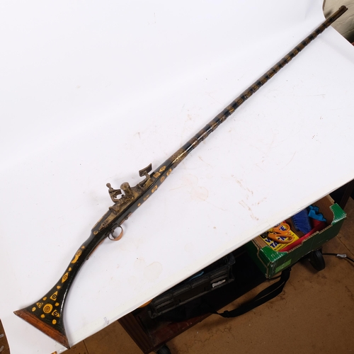 50 - A Moroccan brass and bone inlaid snaphaunce long gun, 150cm