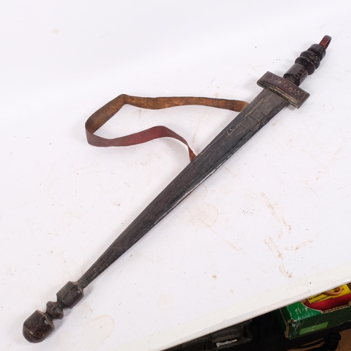 59 - An African Saharan Takouba sword, with leather ring grip and leather sheath, blade length 54cm