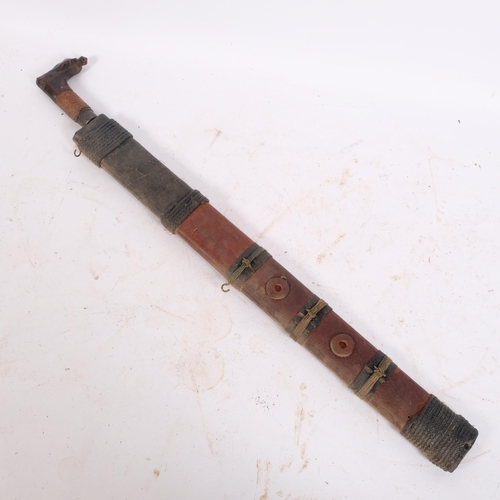 60 - A Borneo Kajan-Dayak Mandau/Parang Ilang knife, with bound hardwood scabbard, blade length 53cm