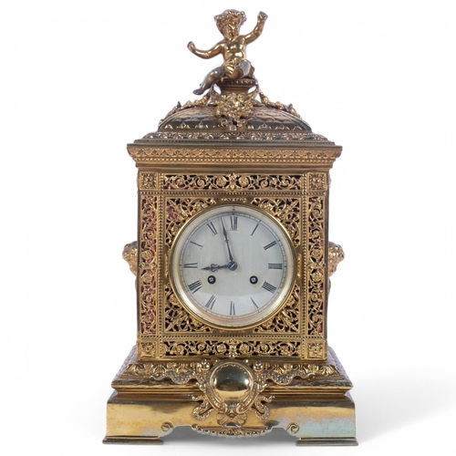 7 - A 19th century French brass mantel clock, silvered dial with Roman numeral hour markers and square s... 