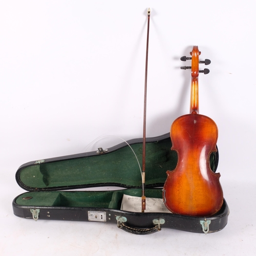 211 - A half-size Chinese violin and bow, label reading Made In Kwangchow, China, back length 12