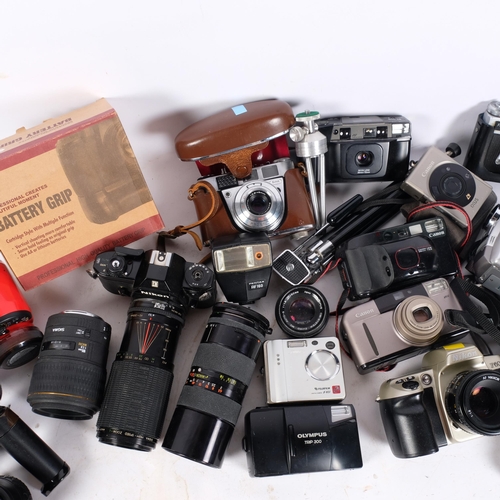 215 - A tray of mixed Vintage cameras and lenses, to including a Nikon M90, Fujifilm F401, camcorders, etc