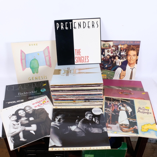 219 - A varied collection of 33 and 1/2 vinyl albums, including Onward International, Men At Work, Ultravo... 