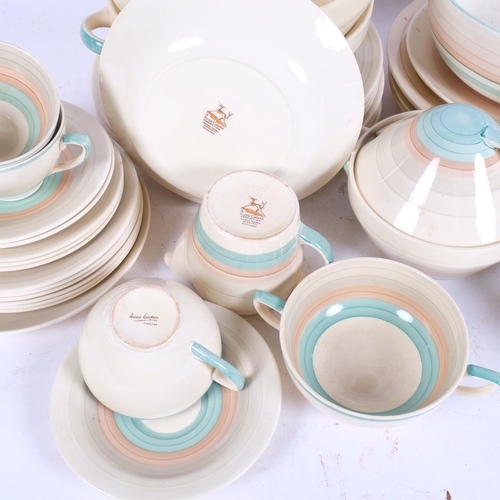 228 - A quantity of Susie Cooper and Grays Pottery dinnerware, including side plates, soup bowls, dinner p... 