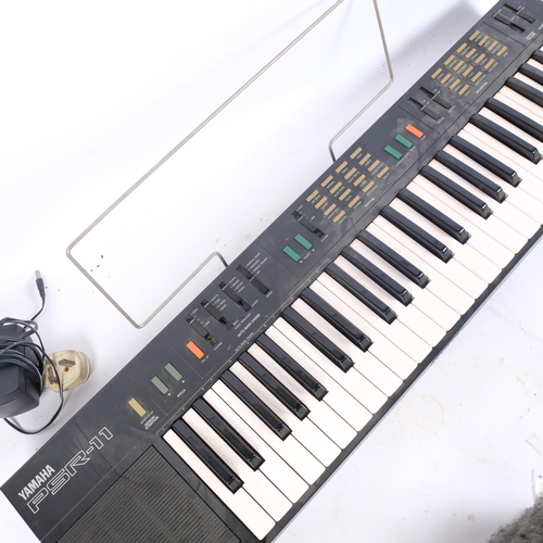 244 - A Yamaha PSR-11 keyboard, with power pack (no stand)