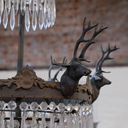 246 - An Antique 4-tier chandelier, metal mounts supported by stags with drop glass lustres, H70cm approx