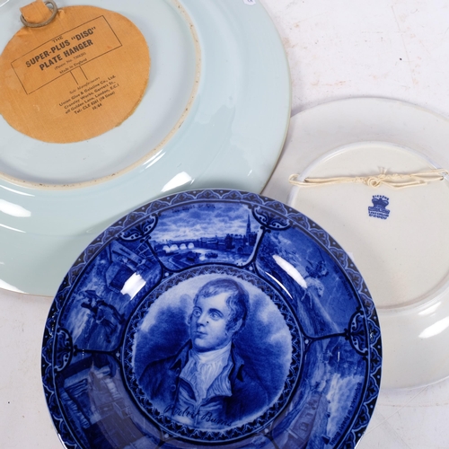 256 - A pair of Staffordshire portrait plaques, depicting Burns and Dickens, and a Japanese blue and white... 