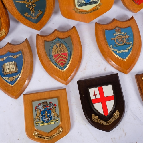 269 - 12 various metal wall plaques on oak mounts, including City Of London Police, H18cm, The Worshipful ... 