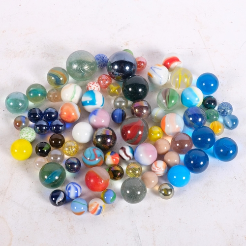 273 - A trayful of glass and china marbles, various sizes