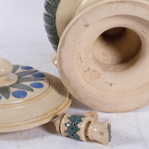 304 - A Victorian Doulton stoneware water filter, with cover and tap, having applied foliate and floral de... 