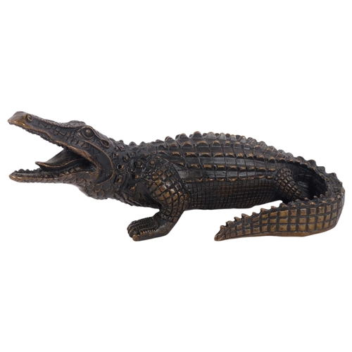 360 - A cast-bronze study of a crocodile, L24cm