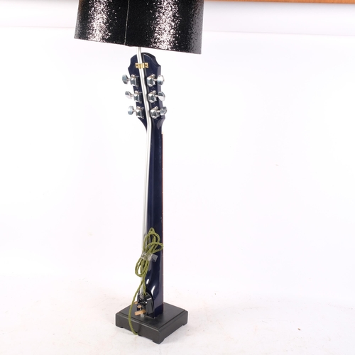 362 - A table lamp fashioned from part of a guitar, with shade, H68cm