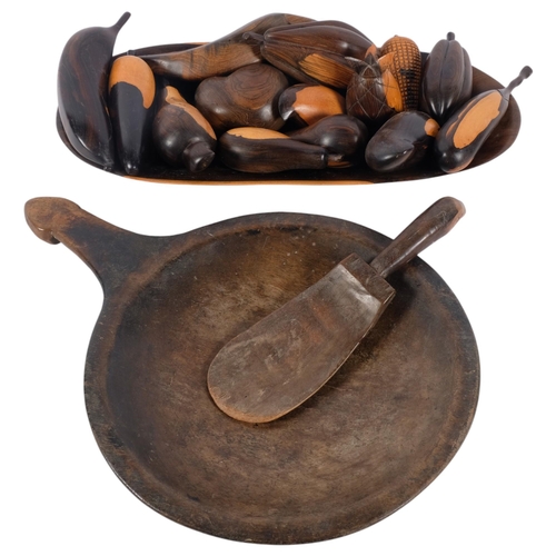 440 - An African Tribal carved wood food bowl and scoop, and a set of modern carved hardwood fruit and veg... 