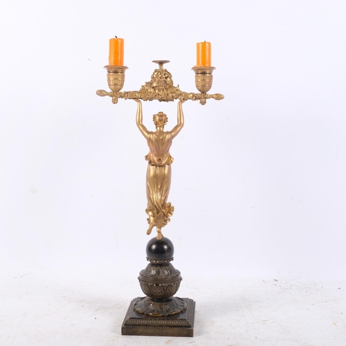 446 - A 19th century gilt-bronze Classical figural twin-branch candelabra, 38cm