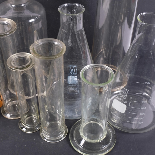 462 - A group of Vintage scientific laboratory glass cylinder and conical measuring flasks, largest 46cm