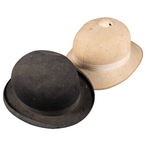 464 - A 1940s pith helmet, and a black bowler hat by Daniel Neal (2)