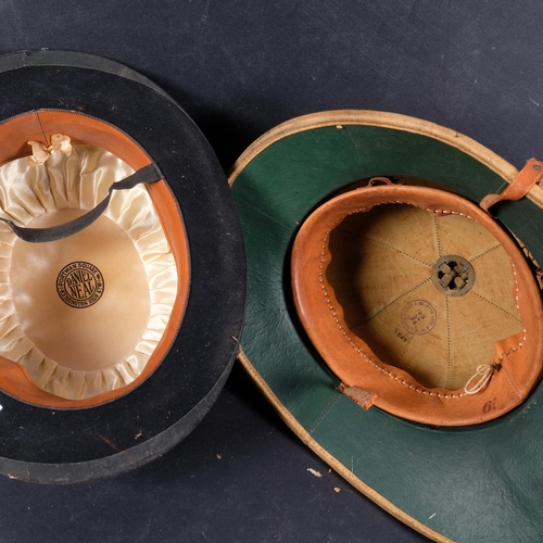 464 - A 1940s pith helmet, and a black bowler hat by Daniel Neal (2)