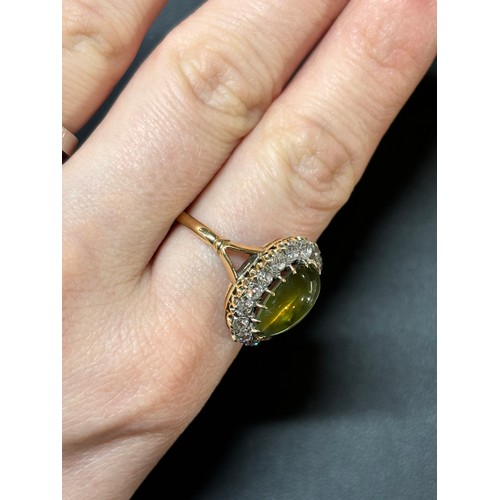 1103 - An Antique 18ct gold cat's eye chrysoberyl and diamond cluster ring, late 19th century, set with a 4... 