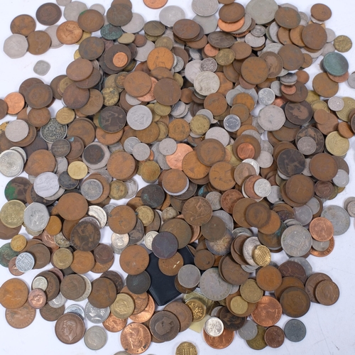 694 - A large quantity of pre-decimal UK and worldwide coins, ten shilling notes, 2 x one pound coins, and... 