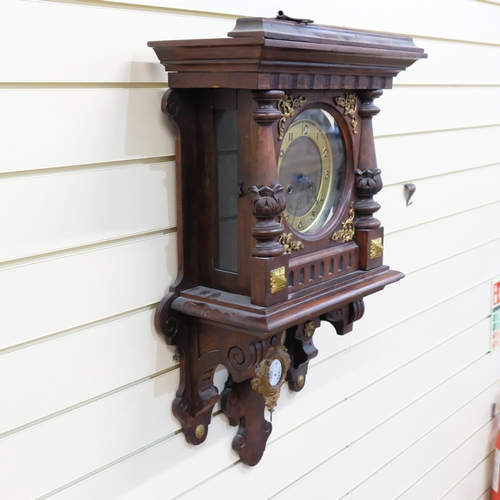 814 - A German walnut-cased wall clock, 8-day striking movement, brass chapter ring, shaped case with bras... 