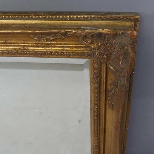 2488 - A resin gilt-framed rectangular wall mirror. Width 106cm, height 75cm.